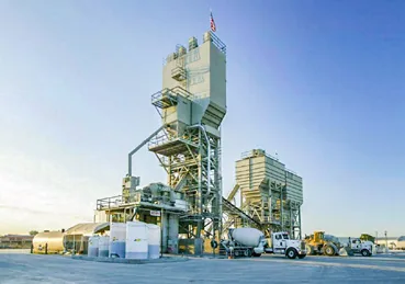 CON-E-CO SLP ready-mix yard wide view with plant, aggregate bin, and mixer truck